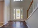 Entryway with hardwood floors and staircase at 2404 Lake Cove Ct, Lithonia, GA 30058