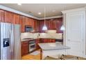 Modern kitchen with granite countertops and stainless steel appliances at 2300 Peachford Rd # 1205, Dunwoody, GA 30338