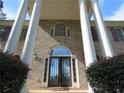 Elegant front entrance with columns and double doors at 5335 Saville Nw Dr, Acworth, GA 30101