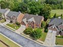 Aerial view of a two-story brick house in a residential neighborhood at 4831 Edinburgh Dr, Smyrna, GA 30082