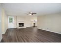Spacious living room with fireplace, vinyl flooring and kitchen view at 3881 Nations Dr, Douglasville, GA 30135