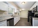 Modern kitchen with white shaker cabinets, granite countertops, and stainless steel appliances at 3881 Nations Dr, Douglasville, GA 30135
