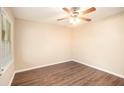 Spacious bedroom with wood-look flooring and ceiling fan at 2112 Royal Fox Way, Decatur, GA 30032