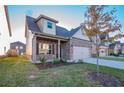 Brick house with beige accents and a two-car garage at 2402 Walker Dr, Hampton, GA 30228