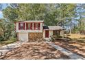 Charming two-story house with stone accents and a red door at 5035 Fairforest Dr, Stone Mountain, GA 30088