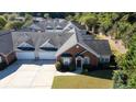 Brick townhouse with private yard and driveway at 204 Somerton Pl, Cumming, GA 30040