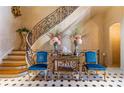 Grand entry with curved staircase and ornate details at 2288 Peachtree Nw Rd # 6, Atlanta, GA 30309