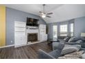 Spacious living room with a fireplace and built-in shelving at 304 Ridge Hill Cir, Canton, GA 30115