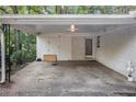 Covered carport provides shelter for vehicles and storage at 2210 Rhinehill Se Rd, Atlanta, GA 30315