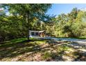 Ranch home nestled on a wooded lot with a spacious yard at 140 Walker Woods Dr, Carrollton, GA 30116