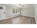 Bright living room with hardwood floors and crown molding at 2434 Miriam Ln, Decatur, GA 30032