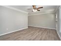 Spacious living room with hardwood floors and ceiling fan at 2434 Miriam Ln, Decatur, GA 30032