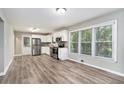 Modern kitchen with stainless steel appliances and vinyl flooring at 2434 Miriam Ln, Decatur, GA 30032