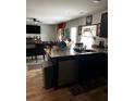 Open concept kitchen with granite island and stainless steel appliances at 3035 Chris Cir, Villa Rica, GA 30180