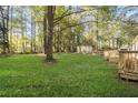 Large backyard with mature trees and deck at 628 Steve Sw Dr, Atlanta, GA 30315