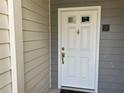 White front door with brass hardware and address number 25 at 25 Fair Haven Way, Smyrna, GA 30080