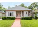 Light blue craftsman home with a walkway and front yard at 668 Peeples Sw St, Atlanta, GA 30310