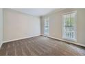 Spacious carpeted bedroom with two large windows at 2459 Jacks View Ct, Snellville, GA 30078