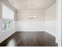 Formal dining room with hardwood floors and wainscoting at 470 Paces Dr, Lithia Springs, GA 30122