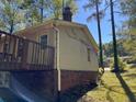 Side view of house showing exterior and deck at 6883 Lakeshore Dr, Douglasville, GA 30135