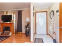 Bright entryway with hardwood floors, a fireplace, and an arched doorway at 3208 Edgemont Way, Decatur, GA 30032