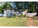 Brick ranch home with a well-manicured lawn and American flag at 3208 Edgemont Way, Decatur, GA 30032