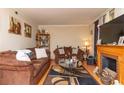 Living room with hardwood floors, a fireplace, and brown sofas at 3208 Edgemont Way, Decatur, GA 30032