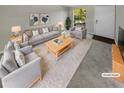 Virtually staged living room with grey sofas and rug at 3541 Old Chamblee Tucker Rd # G, Atlanta, GA 30340