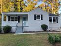Charming renovated brick ranch with a covered porch, updated landscaping, and a fresh coat of paint at 411 Greencove Se Ln, Atlanta, GA 30316