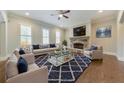 Spacious living room featuring a stone fireplace and hardwood floors at 2423 Rosapenna Nw Ln, Kennesaw, GA 30152