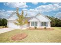 Brick ranch home with attached garage and landscaping at 960 Park Place St, Social Circle, GA 30025