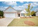 Brick ranch home with attached garage and landscaping at 960 Park Place St, Social Circle, GA 30025
