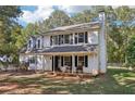 Two-story white house with black shutters and a front porch at 4012 Union Church Sw Rd, Stockbridge, GA 30281