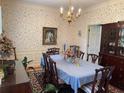 Formal dining room with a large table and china cabinet at 220 Spalding Lake Pl, Atlanta, GA 30350
