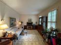 Living room featuring a sofa, and a wooden cabinet at 220 Spalding Lake Pl, Atlanta, GA 30350