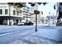 Street view of a city intersection with crosswalks and traffic at 32 Peachtree Nw St # 1006, Atlanta, GA 30303