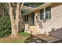 Charming brick ranch home with covered porch and established landscaping at 906 Courtenay Ne Dr, Atlanta, GA 30306