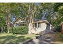 Brick house with a well-manicured lawn and driveway at 906 Courtenay Ne Dr, Atlanta, GA 30306