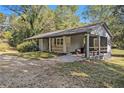 Updated ranch home with covered porch and landscaping at 93 Floyd Ln, Hampton, GA 30228