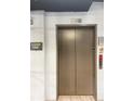 Clean and well-lit elevator lobby with tiled floors at 425 Chapel Sw St # 1206, Atlanta, GA 30313