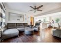 Spacious living room with hardwood floors and grey sectional sofa at 386 Black Oak Ct, Lawrenceville, GA 30046