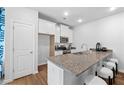 Modern kitchen with granite countertops and stainless steel appliances at 1916 School House Ln, Temple, GA 30179