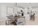 Dining area with a large table and kitchen view at 402 Beacon Way, Villa Rica, GA 30180