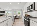 Modern kitchen with granite countertops and stainless steel appliances at 402 Beacon Way, Villa Rica, GA 30180