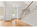 Bright and spacious entryway with hardwood floors and staircase at 2865 Payton Oaks Ne Dr, Atlanta, GA 30345