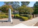 Mill Park community entrance with a stone monument at 244 Rope Mill Rd, Woodstock, GA 30188