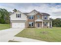 Two story home with brick and siding exterior at 205 Blanton Ln, Stockbridge, GA 30281