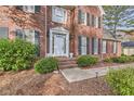 Front entryway with brick steps and landscaping at 2582 Fairview Ln, Jonesboro, GA 30236