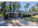 Front view of ranch home with driveway and landscaping at 2775 Tilson Rd, Decatur, GA 30032