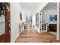 Bright entryway with hardwood floors and decorative console table at 5860 Bluff Heights Dr, Cumming, GA 30040